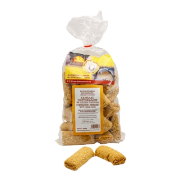 Premium Cretan Cookies with Cinnamon, Orange, and Local Raki Handcrafted premium Cretan cookies featuring cinnamon, orange zest, and local raki, beautifully arranged on a rustic wooden table.