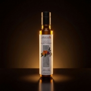 A premium studio shot of Biolea Organic Bitter Orange Olive Oil highlighting the golden liquid and the stone-milled Koroneiki olive quality.