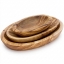 Set of three handcrafted olive wood oval dishes, nested together, with visible natural wood grain on a white background